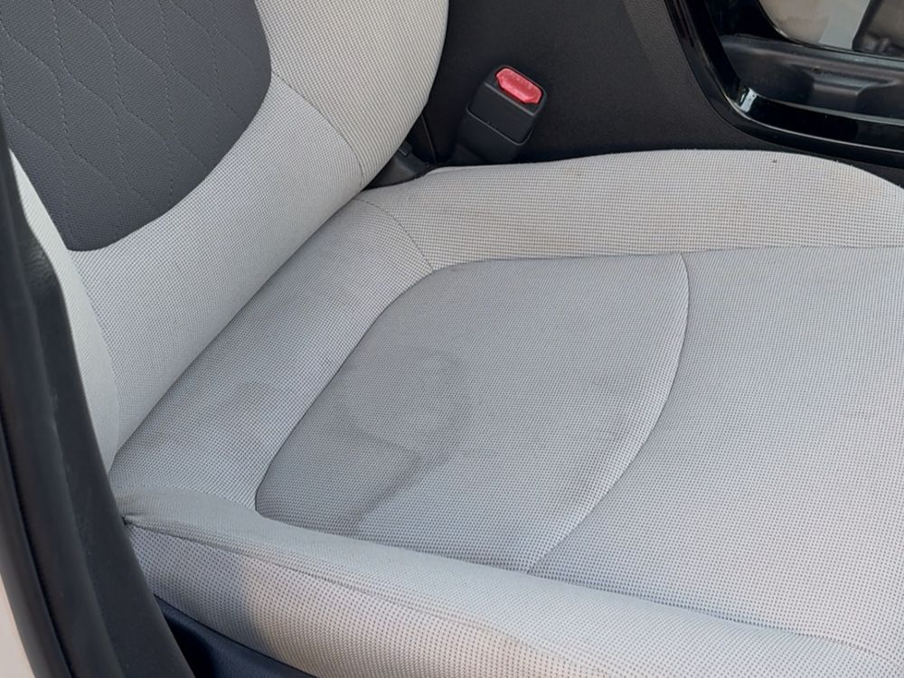 Cloth seat before cleaning, with a large stain